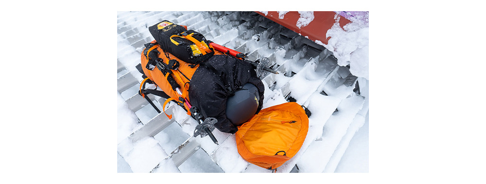 Arc'teryx Alpha AR 35 Backpack with helmet and ice axe display