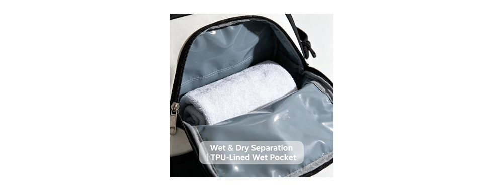 Close‑up of TPU‑lined wet dry separation pocket inside gym bag with rolled towel